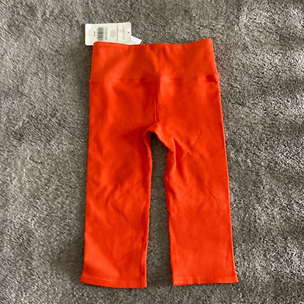 Woman’s Orange Fabletics Capris